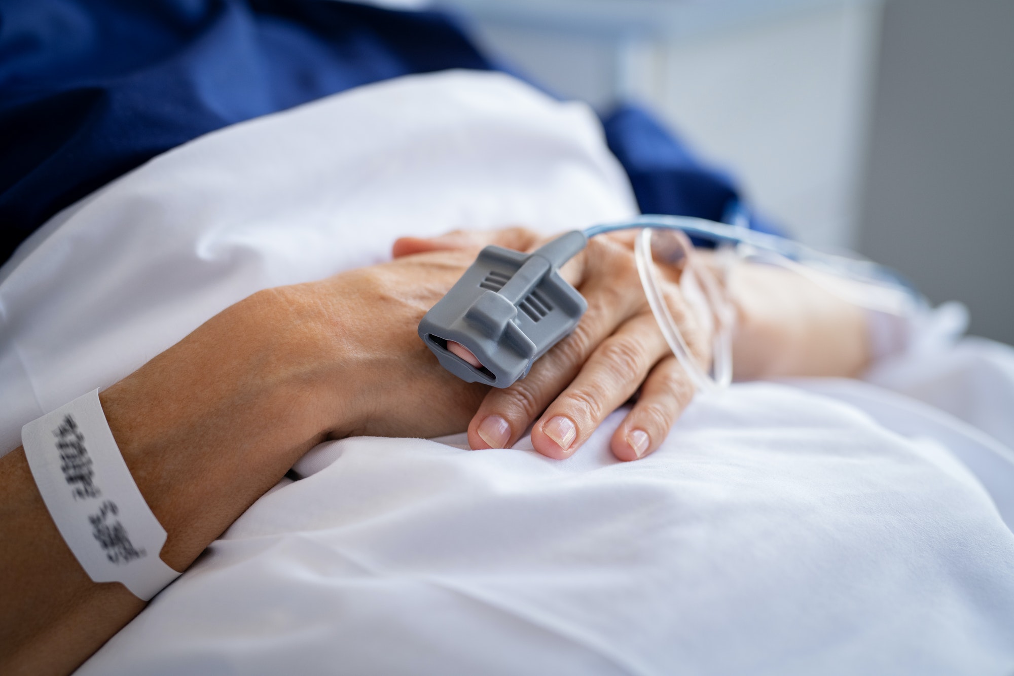 Patient hands with IV drip in hospital